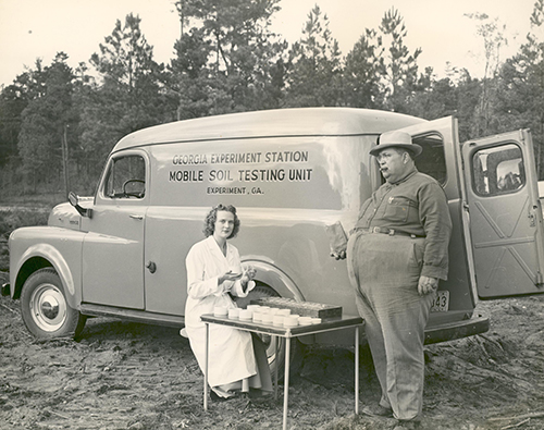 Researchers pose with the Georgia Experiment Station Mobile Soil Testing Unit, circa early 1950s
